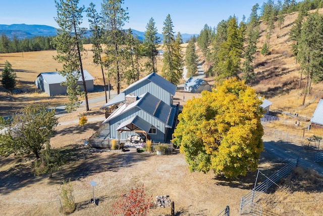birds eye view of property with a mountain view and a rural view