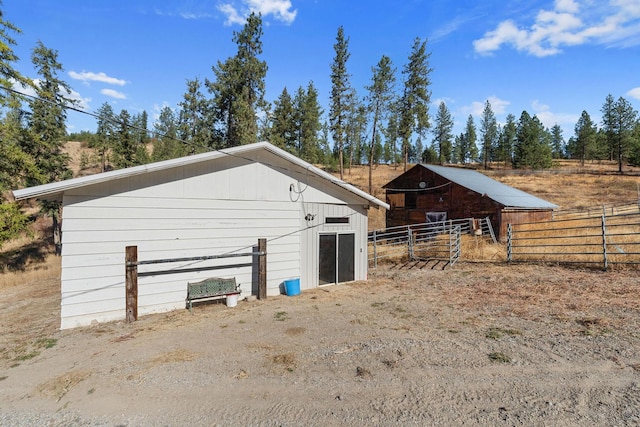 view of outbuilding featuring a rural view