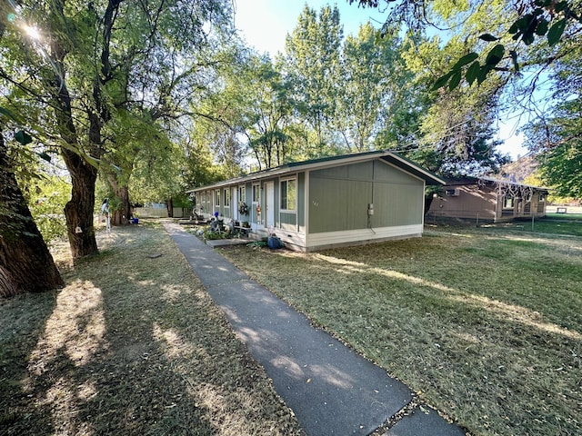 view of side of home featuring a lawn