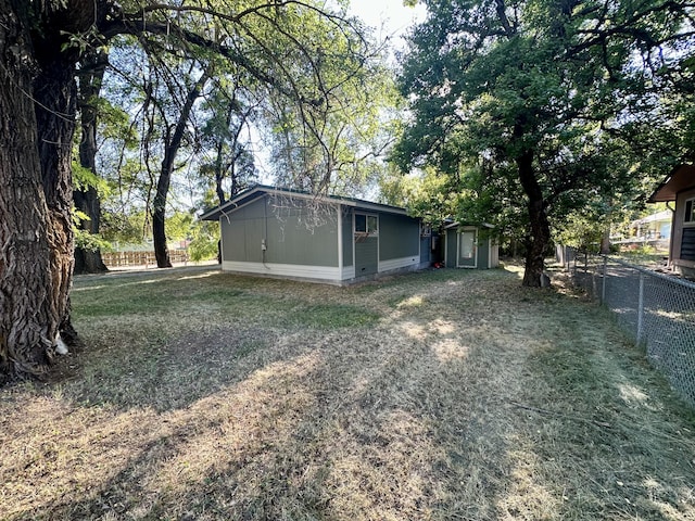 exterior space with a shed