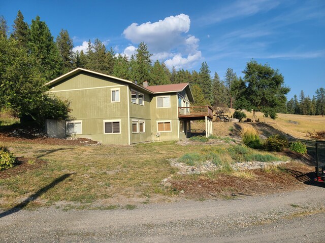 view of side of home featuring a deck