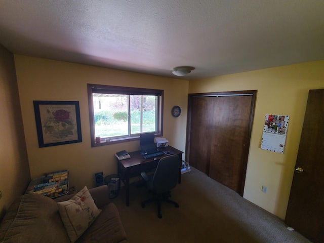 home office featuring a textured ceiling