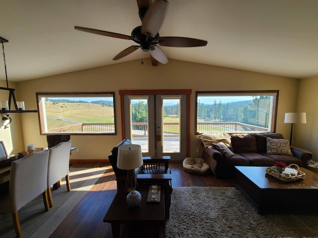 living room with ceiling fan, french doors, dark hardwood / wood-style flooring, and lofted ceiling