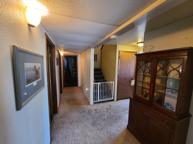 hallway featuring light carpet