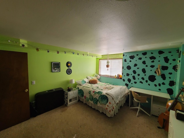 bedroom featuring carpet flooring and a textured ceiling