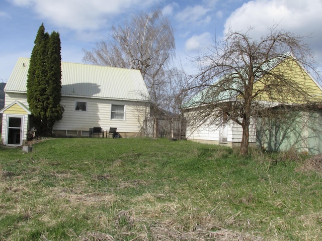 view of home's exterior featuring a lawn