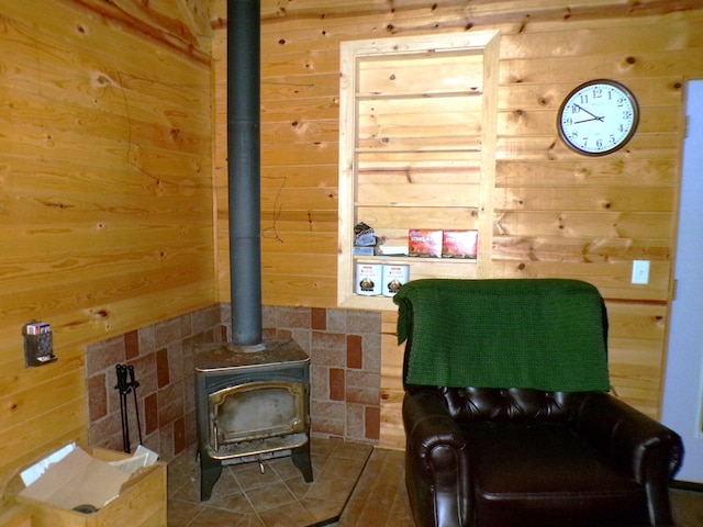 3121 Fifteen Mile Creek Rd, Kettle Falls, WA 99141 - sitting room with wood walls and a wood stove