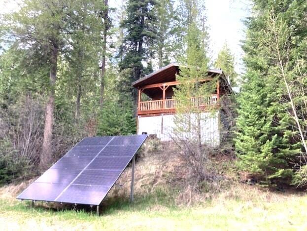 3121 Fifteen Mile Creek Rd, Kettle Falls, WA 99141 - view of outbuilding featuring a view of trees and solar panels