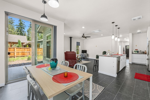 250 Hogans Way, Chewelah, WA 99109 - dining area with recessed lighting, ceiling fan, and dark tile patterned floors