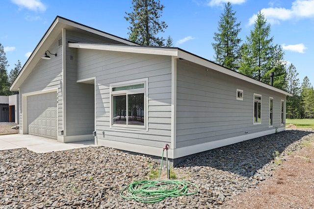 250 Hogans Way, Chewelah, WA 99109 - view of home's exterior featuring an attached garage and driveway