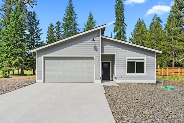 250 Hogans Way, Chewelah, WA 99109 - mid-century modern home featuring driveway and a garage