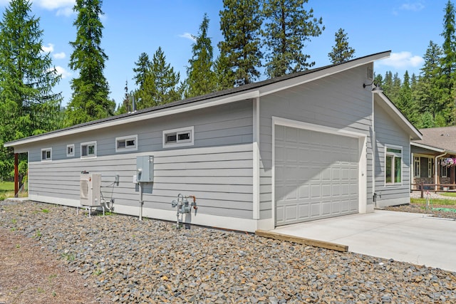 250 Hogans Way, Chewelah, WA 99109 - view of side of property with concrete driveway and an attached garage