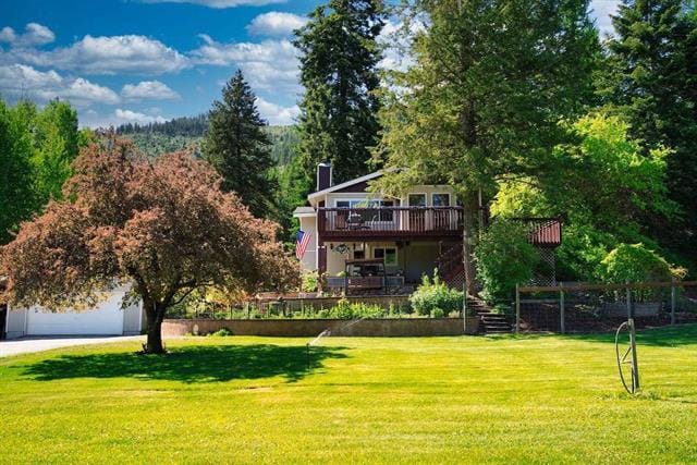 view of yard featuring a wooden deck