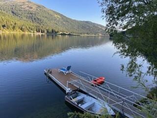 2952 Deep Lake Boundary Rd, Colville, WA 99114 - dock featuring a water and mountain view and a forest view