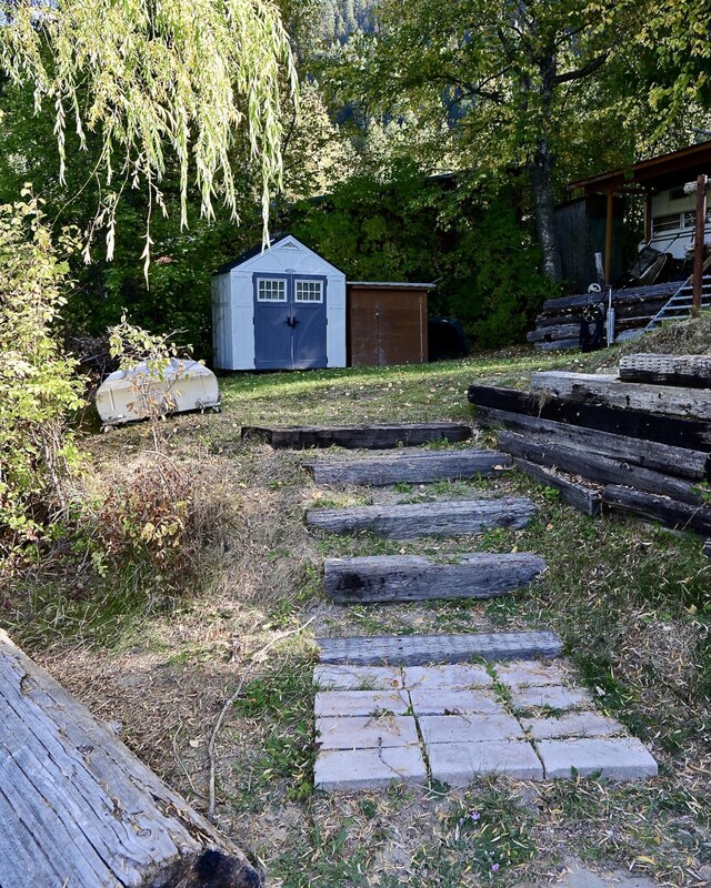 2952 Deep Lake Boundary Rd, Colville, WA 99114 - view of yard with a storage unit and an outdoor structure