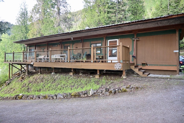 2952 Deep Lake Boundary Rd, Colville, WA 99114 - view of front of property with metal roof and a wooden deck