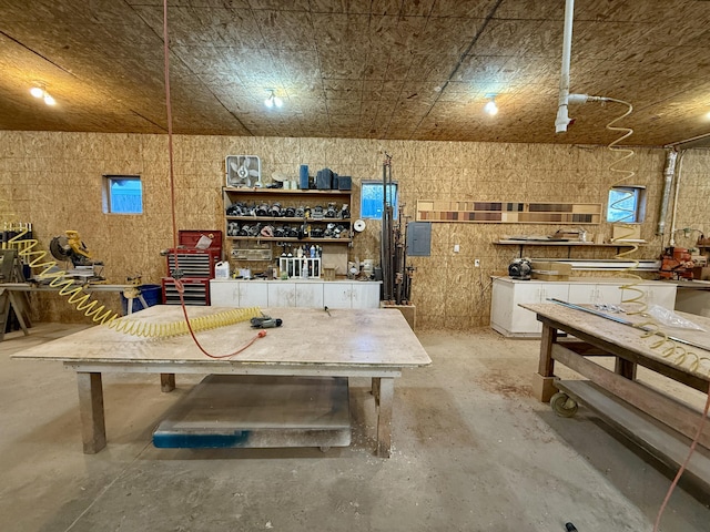 interior space with a workshop area and concrete floors