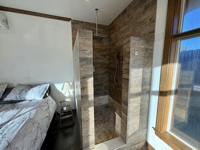 bathroom featuring a tile shower