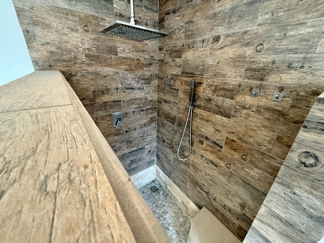 bathroom with a tile shower