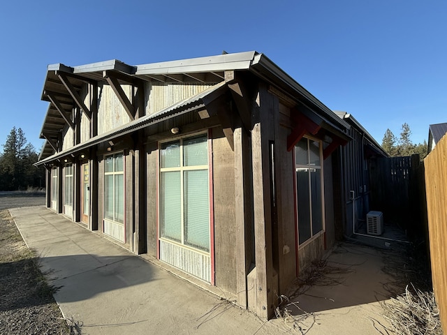 view of property exterior with a patio area