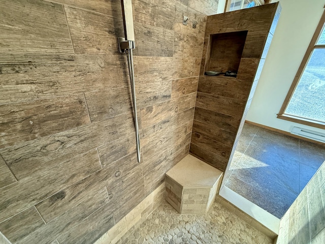 bathroom with tiled shower