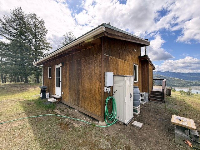 108 Grizzly Loop, Republic, WA 99166 - view of side of property featuring a deck with mountain view