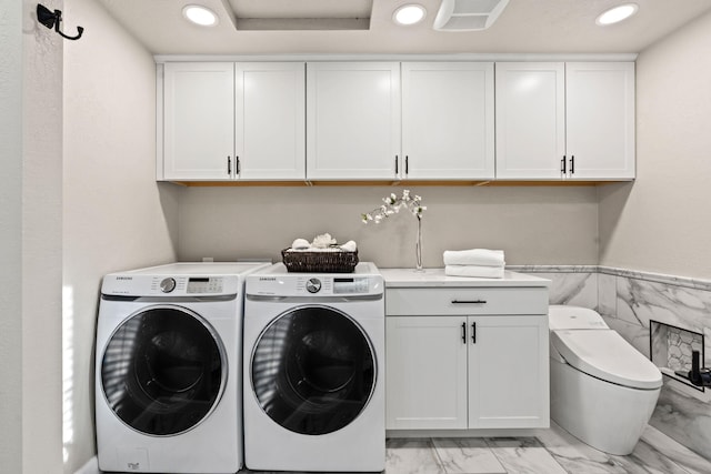 4203 S Suncrest Ln, Spokane Valley, WA 99037 - laundry room with light marble finish flooring, independent washer and dryer, recessed lighting, cabinet space, and tile walls