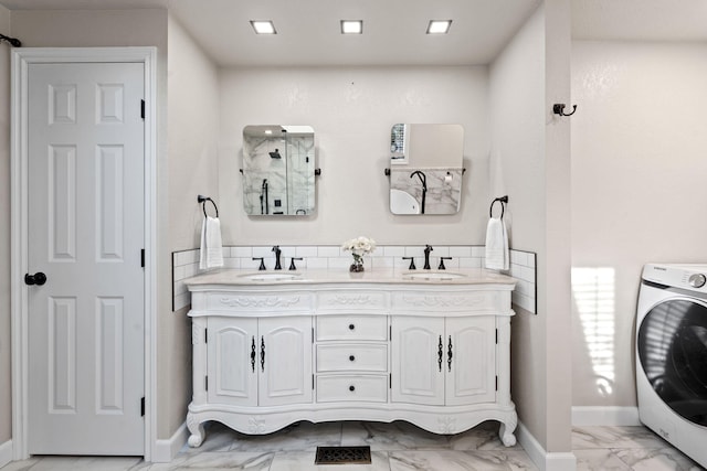 4203 S Suncrest Ln, Spokane Valley, WA 99037 - full bathroom with washer / clothes dryer, marble look tiles, double vanity, and a shower