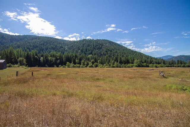 property view of mountains featuring a rural view