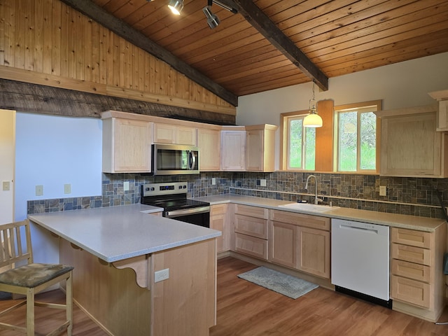 1612 Rickey Canyon Rd, Kettle Falls, WA 99141 - kitchen with appliances with stainless steel finishes, light brown cabinets, a peninsula, wooden ceiling, and backsplash