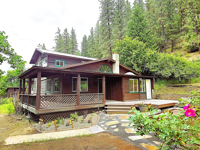 1612 Rickey Canyon Rd, Kettle Falls, WA 99141 - chalet / cabin featuring a chimney
