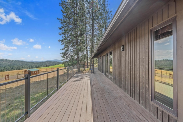 wooden terrace with a mountain view and a rural view