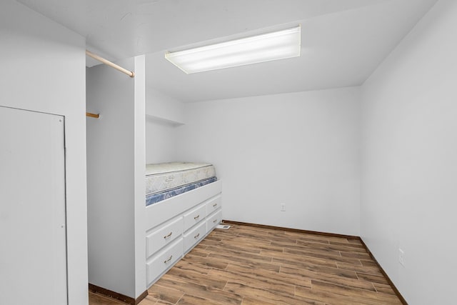 unfurnished bedroom with dark hardwood / wood-style floors