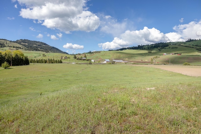 mountain view featuring a rural view