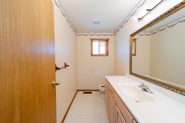 bathroom with visible vents, baseboards, toilet, tile patterned floors, and vanity