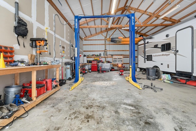 garage with metal wall and a workshop area