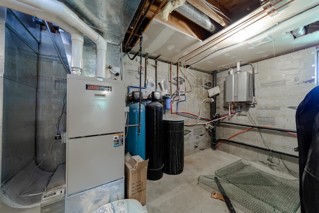 utilities with tankless water heater and visible vents