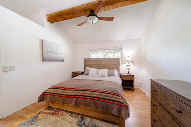 bedroom featuring vaulted ceiling with beams, light wood-style floors, ceiling fan, and baseboards