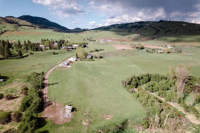 aerial view with a mountain view and a rural view