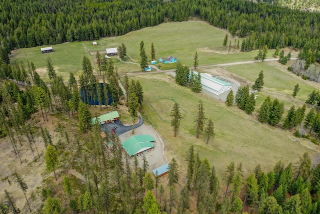 birds eye view of property with a rural view