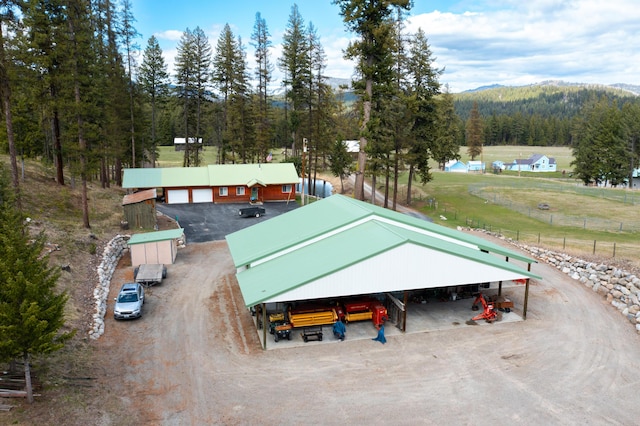 birds eye view of property featuring a mountain view