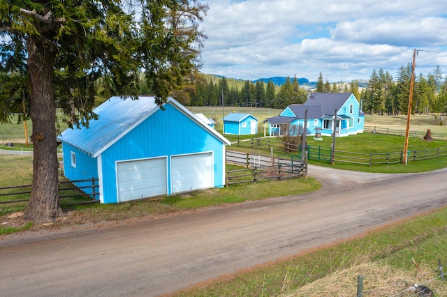 exterior space with a yard and a garage