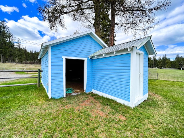 view of outdoor structure with a lawn