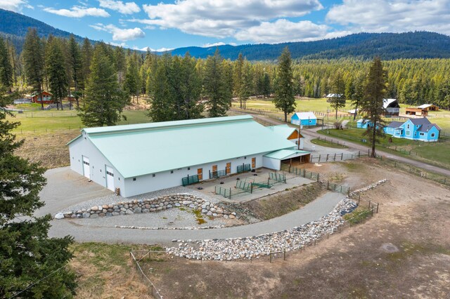 birds eye view of property featuring a mountain view