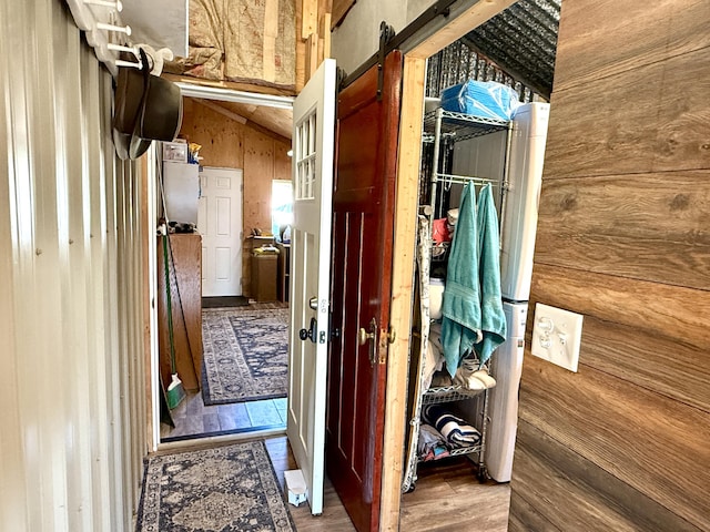 3305 Bradeen Rd, Rice, WA 99167 - hall with wood walls, wood finished floors, a barn door, and lofted ceiling
