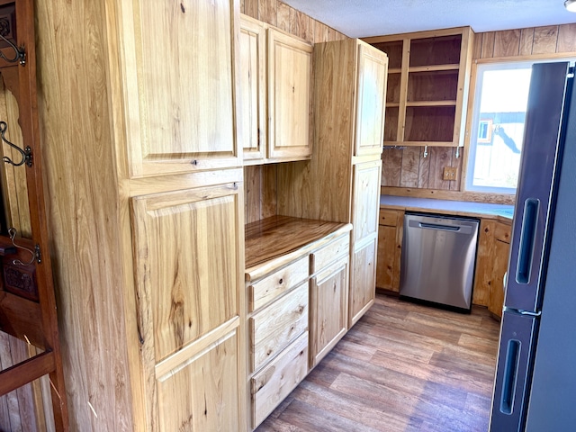 3305 Bradeen Rd, Rice, WA 99167 - kitchen with dishwasher, fridge with ice dispenser, light countertops, light wood-style flooring, and light brown cabinetry