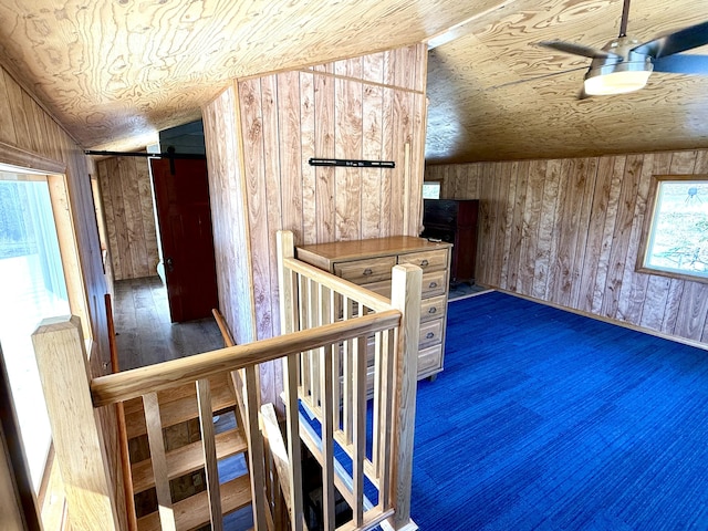 3305 Bradeen Rd, Rice, WA 99167 - bonus room featuring lofted ceiling, wood walls, a barn door, and wood ceiling