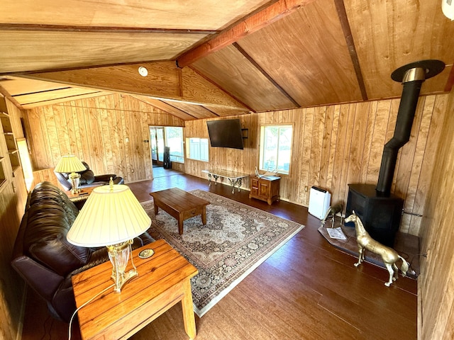 3305 Bradeen Rd, Rice, WA 99167 - living room with wood finished floors, wooden walls, wooden ceiling, and a wood stove
