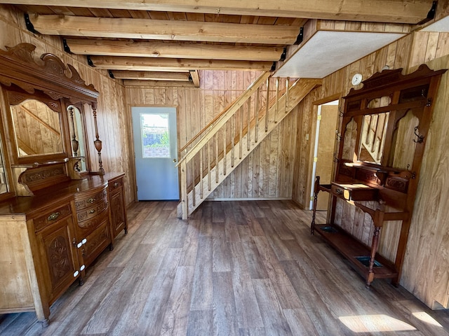 3305 Bradeen Rd, Rice, WA 99167 - entrance foyer with dark wood-style floors, stairs, wood walls, and a wood ceiling with exposed beams