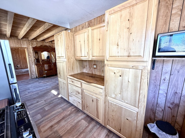 3305 Bradeen Rd, Rice, WA 99167 - kitchen featuring light brown cabinetry, dark wood-style floors, and wooden walls
